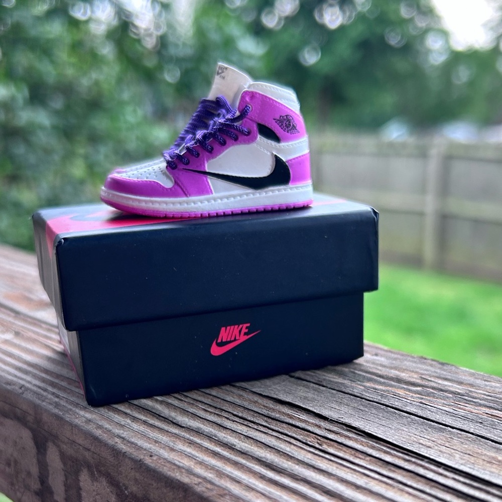 Pair of Nike Air Jordan 1 High Top in Pink, Black & White Travis Scott Keychains